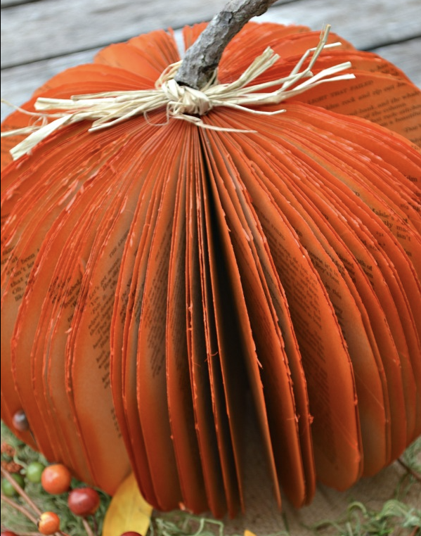 This is a book where the pages have been cut, colored, and tied to a stick to look like a pumpkin.